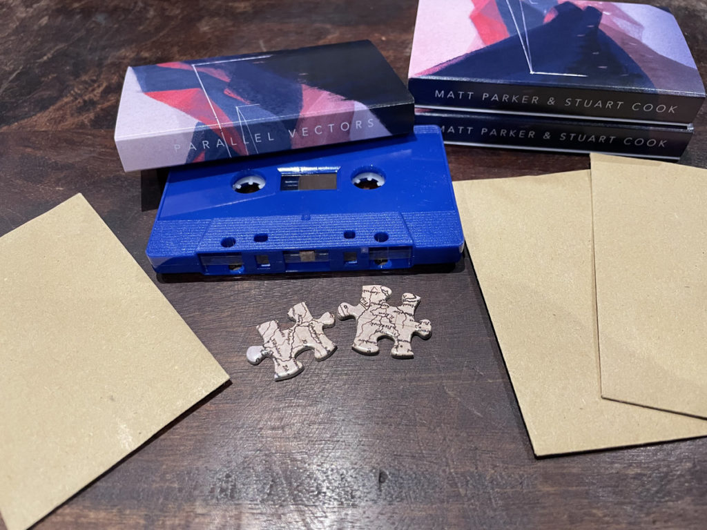cassette tape and puzzle pieces for album release
